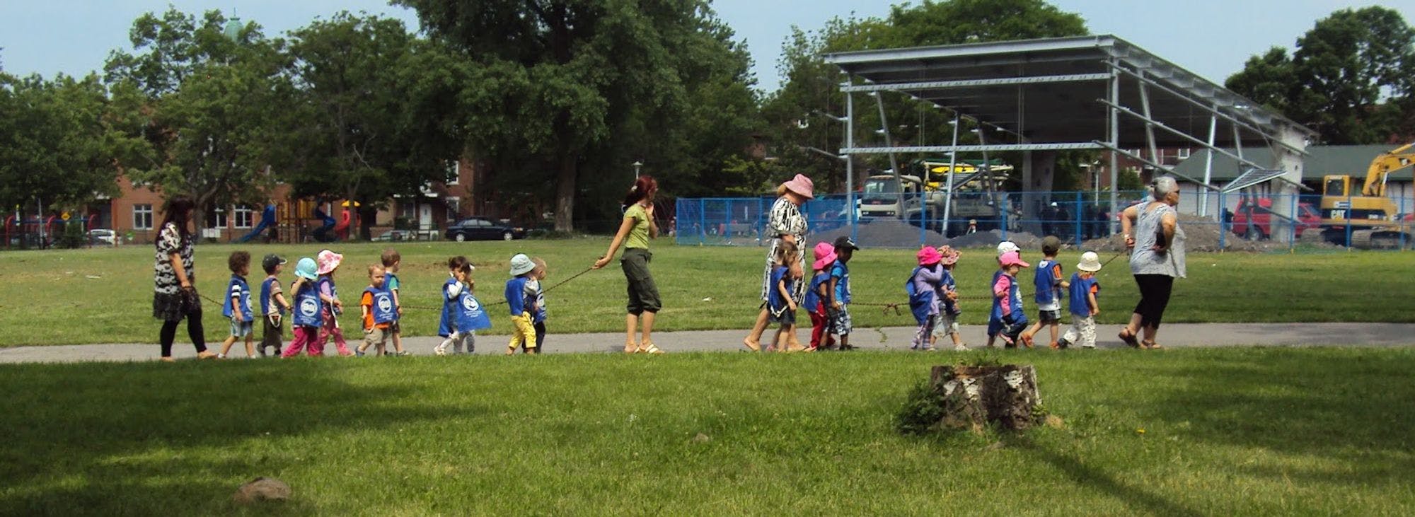 Children from a local daycare walking at Jean-Brillant park in Montreal, Quebec.